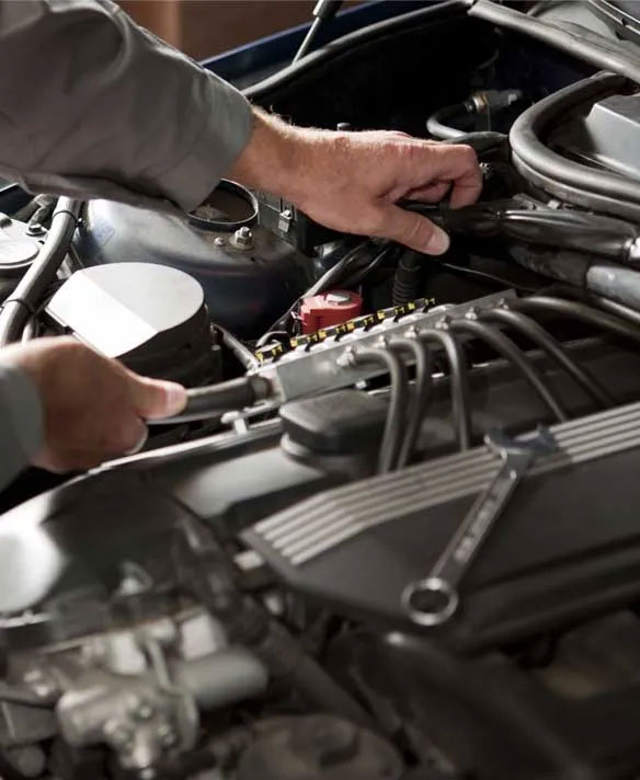 Technician performing car brake inspection near Los Gatos, CA
