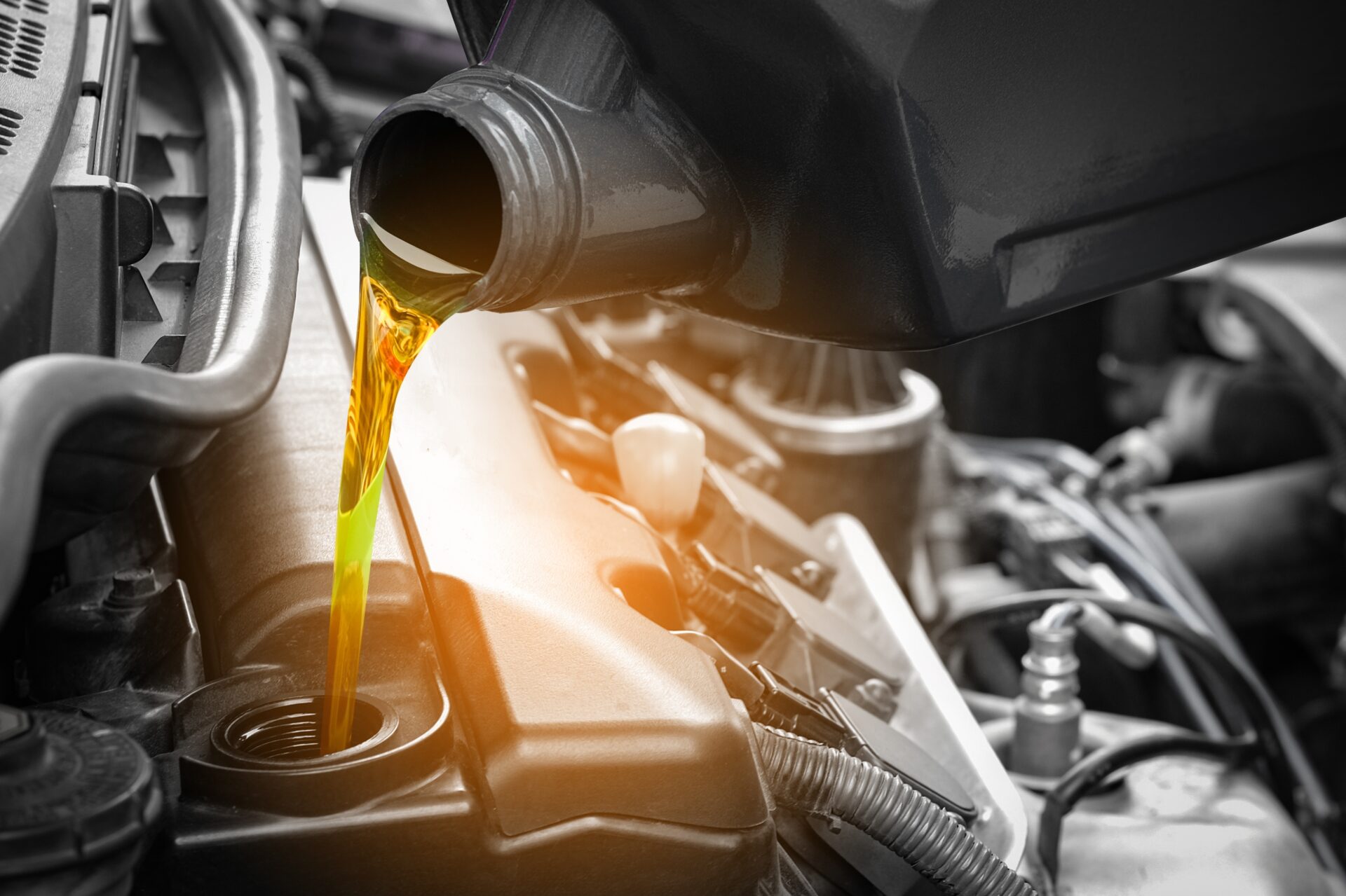 Refueling,and,pouring,oil,quality,into,the,engine,motor,car
